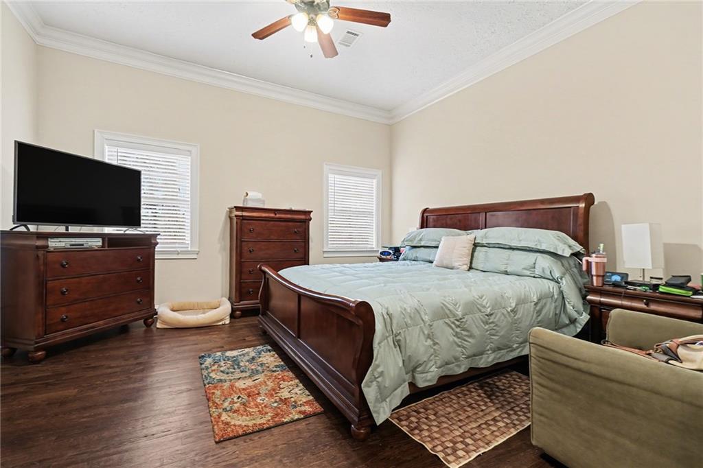 5026 Campbellton Road Southwest Atlanta, GA 30331 - Photo 30 of 39 a bedroom with a bed and flat screen tv