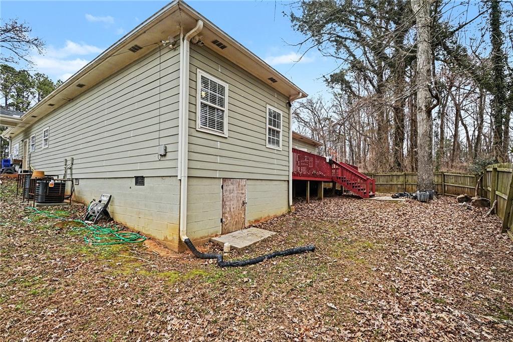 5026 Campbellton Road Southwest Atlanta, GA 30331 - Photo 36 of 39 a view of a house with a yard
