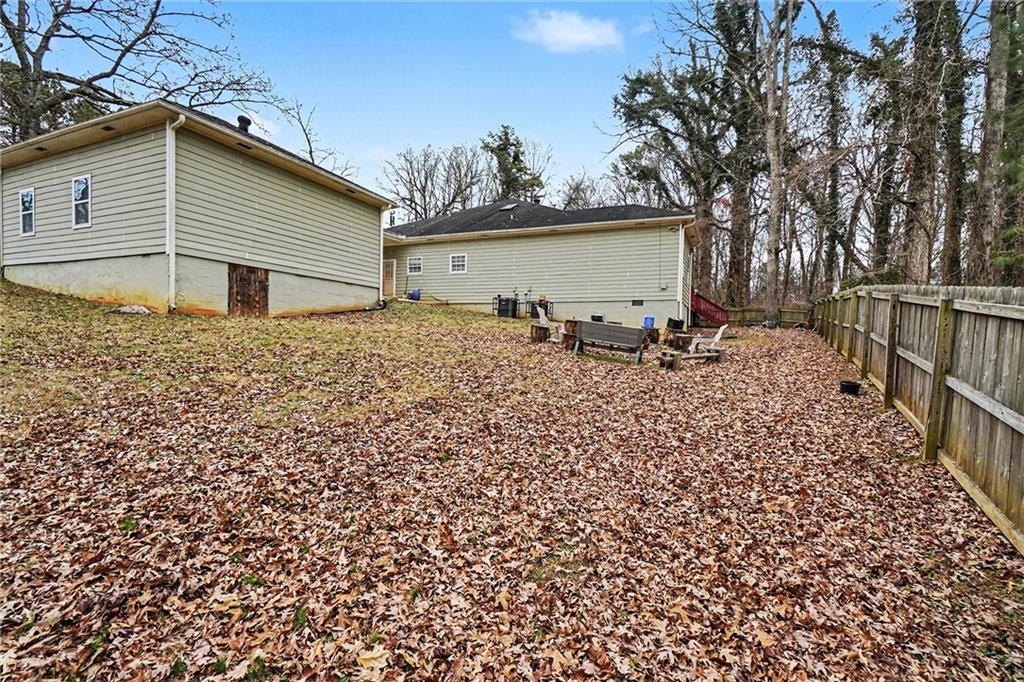 5026 Campbellton Road Southwest Atlanta, GA 30331 - Photo 38 of 39 a backyard of a house with table and chairs