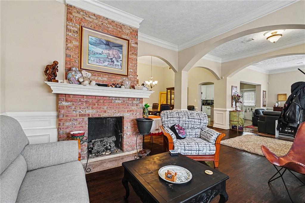 5026 Campbellton Road Southwest Atlanta, GA 30331 - Photo 7 of 39 a living room with furniture and a fireplace