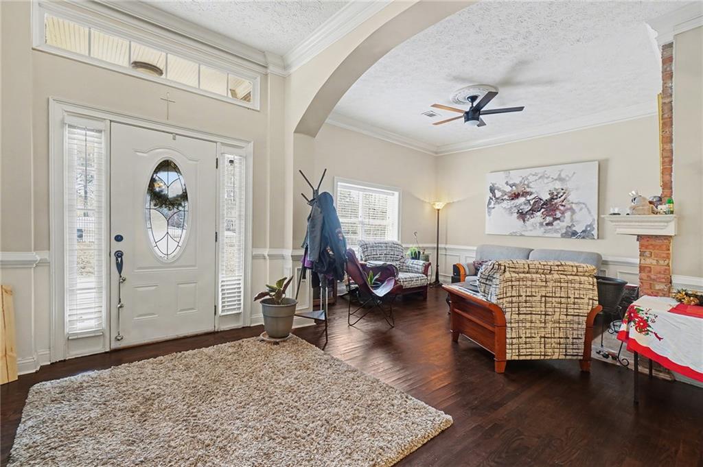 5026 Campbellton Road Southwest Atlanta, GA 30331 - Photo 9 of 39 a living room with furniture stairs and a window