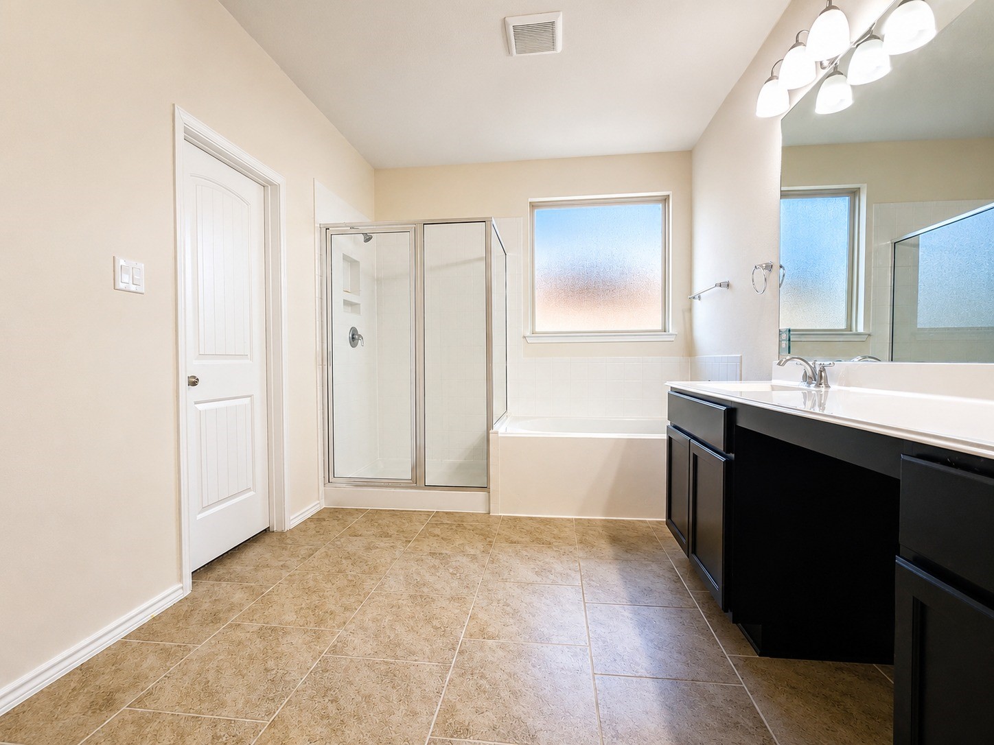 24315 Ravenna Landing Loop Spring, TX 77389 - Photo 29 of 37 a bathroom with a bathtub sink vanity and mirror