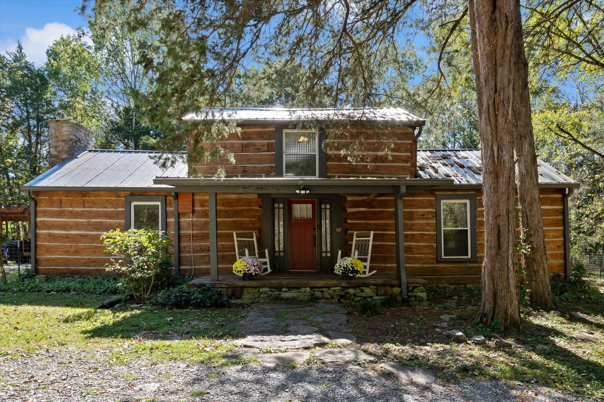 a front view of a house with garden