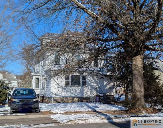 a front view of a house with parking space