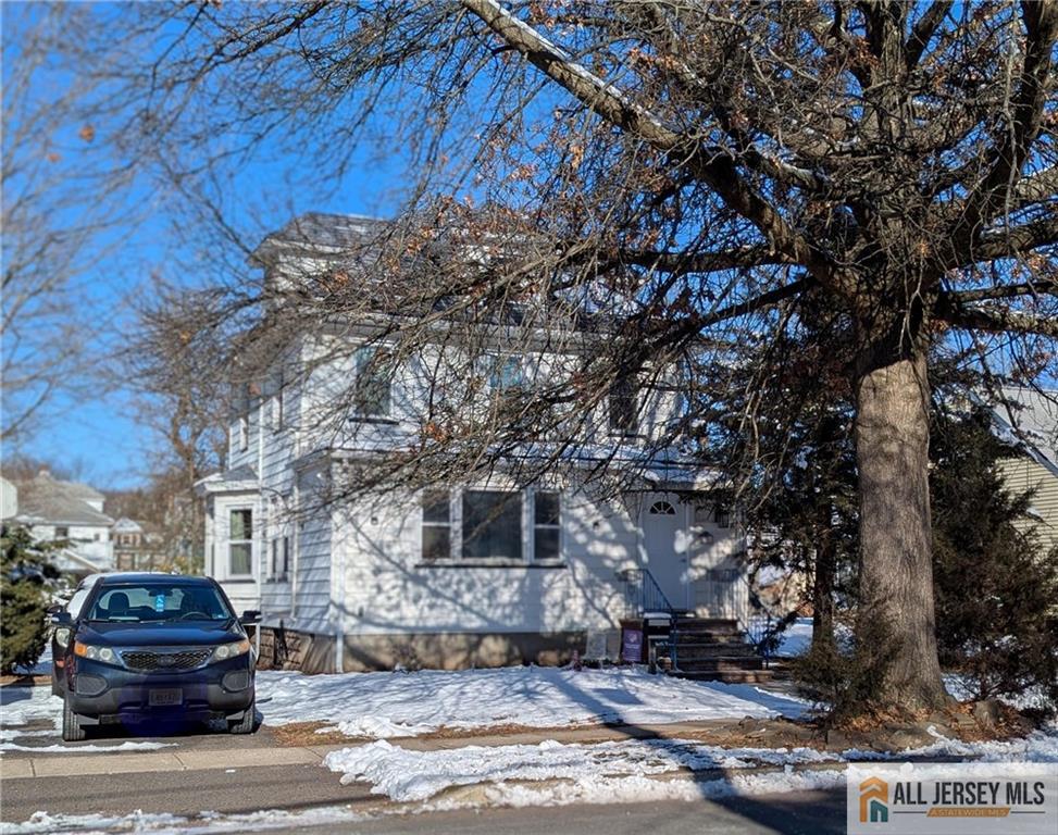 220 1st Street Dunellen, NJ 08812 - Photo 1 of 23 a front view of a house with parking space