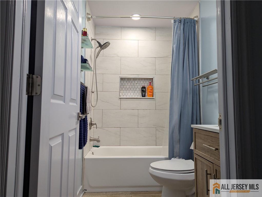 220 1st Street Dunellen, NJ 08812 - Photo 12 of 23 a bathroom with a toilet and a shower