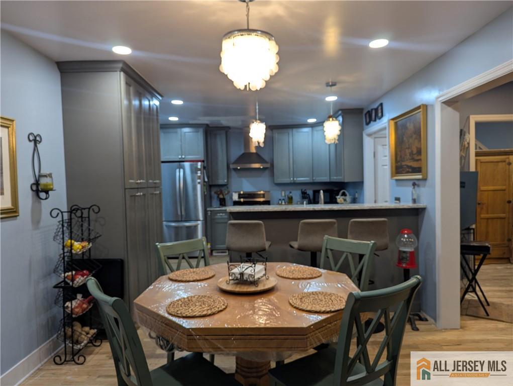 220 1st Street Dunellen, NJ 08812 - Photo 2 of 23 a view of a dining room with furniture and wooden floor