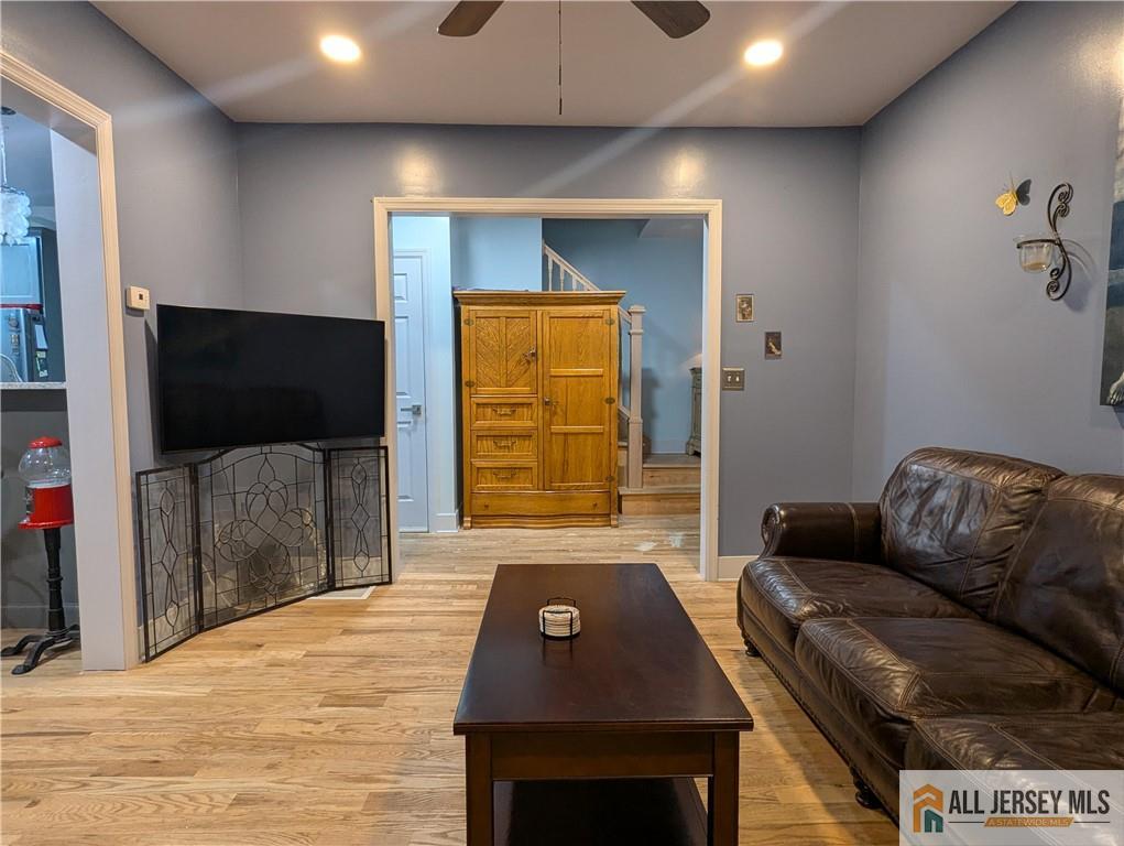220 1st Street Dunellen, NJ 08812 - Photo 4 of 23 a living room with furniture and a flat screen tv
