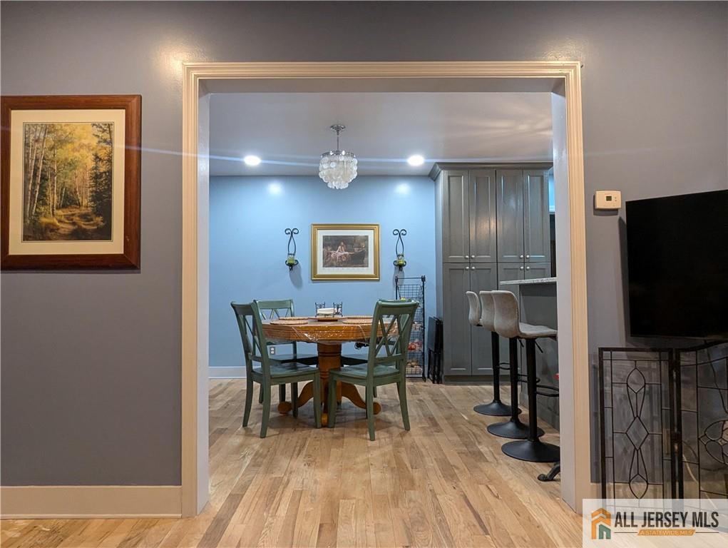 220 1st Street Dunellen, NJ 08812 - Photo 5 of 23 a view of a dining room with furniture and wooden floor