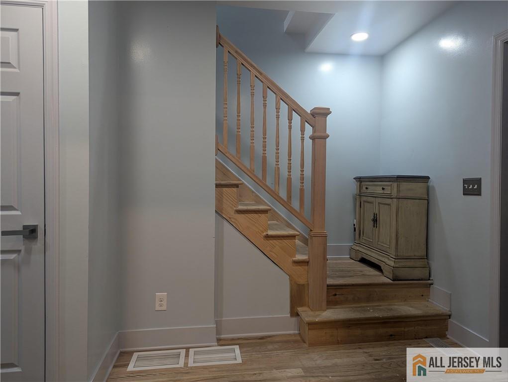 220 1st Street Dunellen, NJ 08812 - Photo 8 of 23 a view of entryway and hall with wooden floor