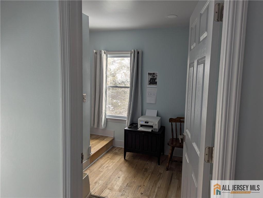 220 1st Street Dunellen, NJ 08812 - Photo 9 of 23 a view of a workspace with furniture and a window