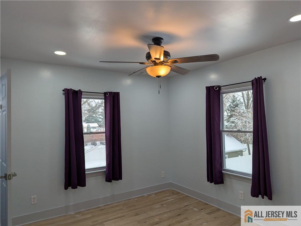 220 1st Street Dunellen, NJ 08812 - Photo 10 of 23 an empty room with windows and closet