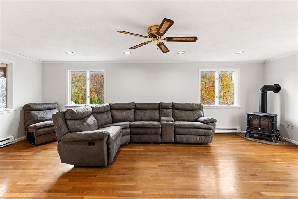 10 Apache Trail Medford, MA 02155 - Photo 13 of 41 a living room with furniture and a flat screen tv