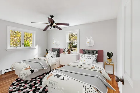 a bedroom with bed and a chandelier