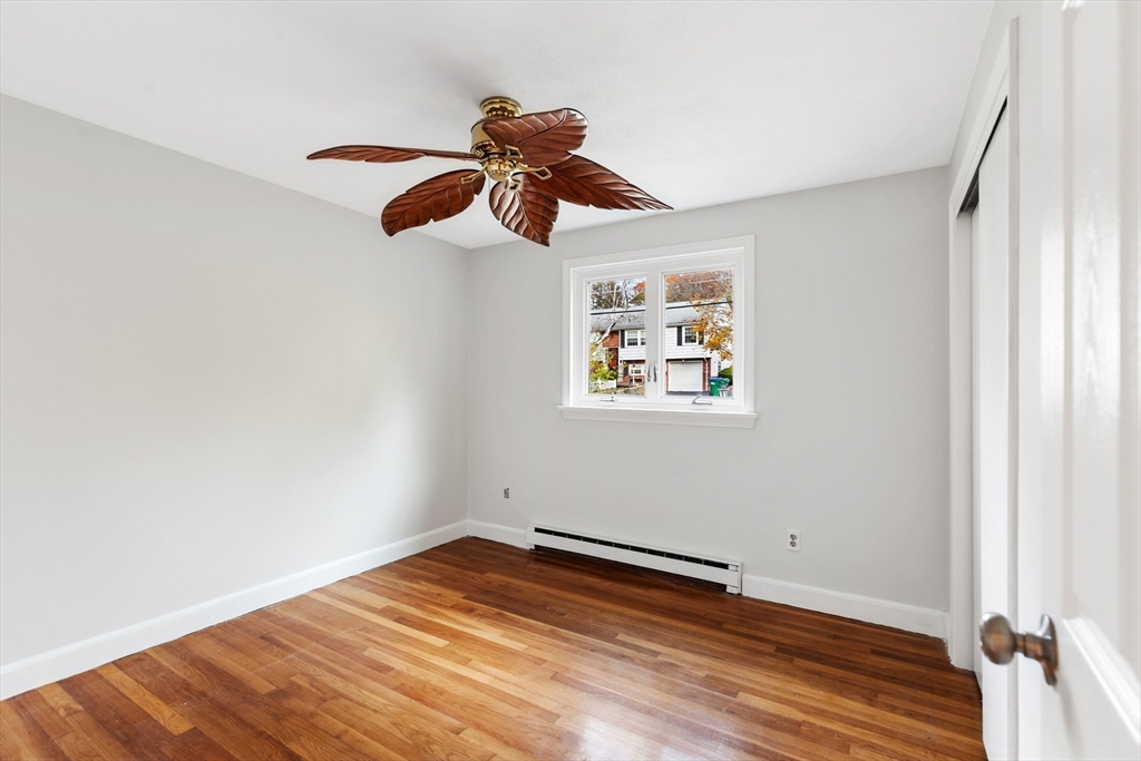10 Apache Trail Medford, MA 02155 - Photo 23 of 41 a view of empty room with wooden floor