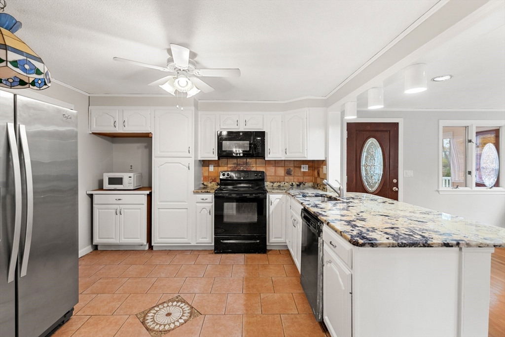 10 Apache Trail Medford, MA 02155 - Photo 10 of 41 a kitchen with a refrigerator sink and stove