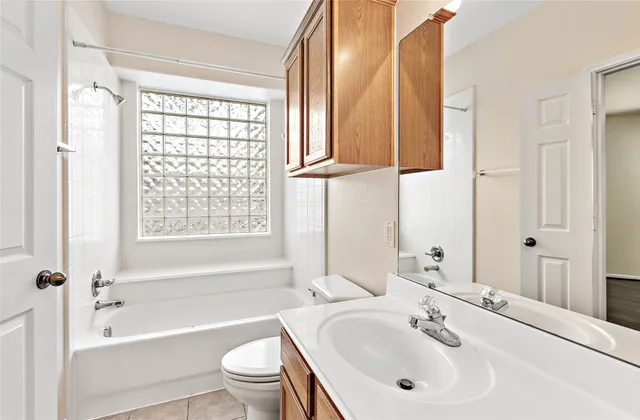 a bathroom with a double vanity sink mirror and