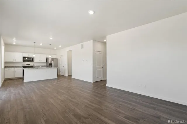 a view of kitchen with wooden floor