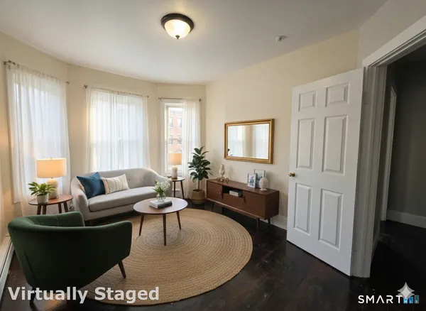 a living room with furniture and a window