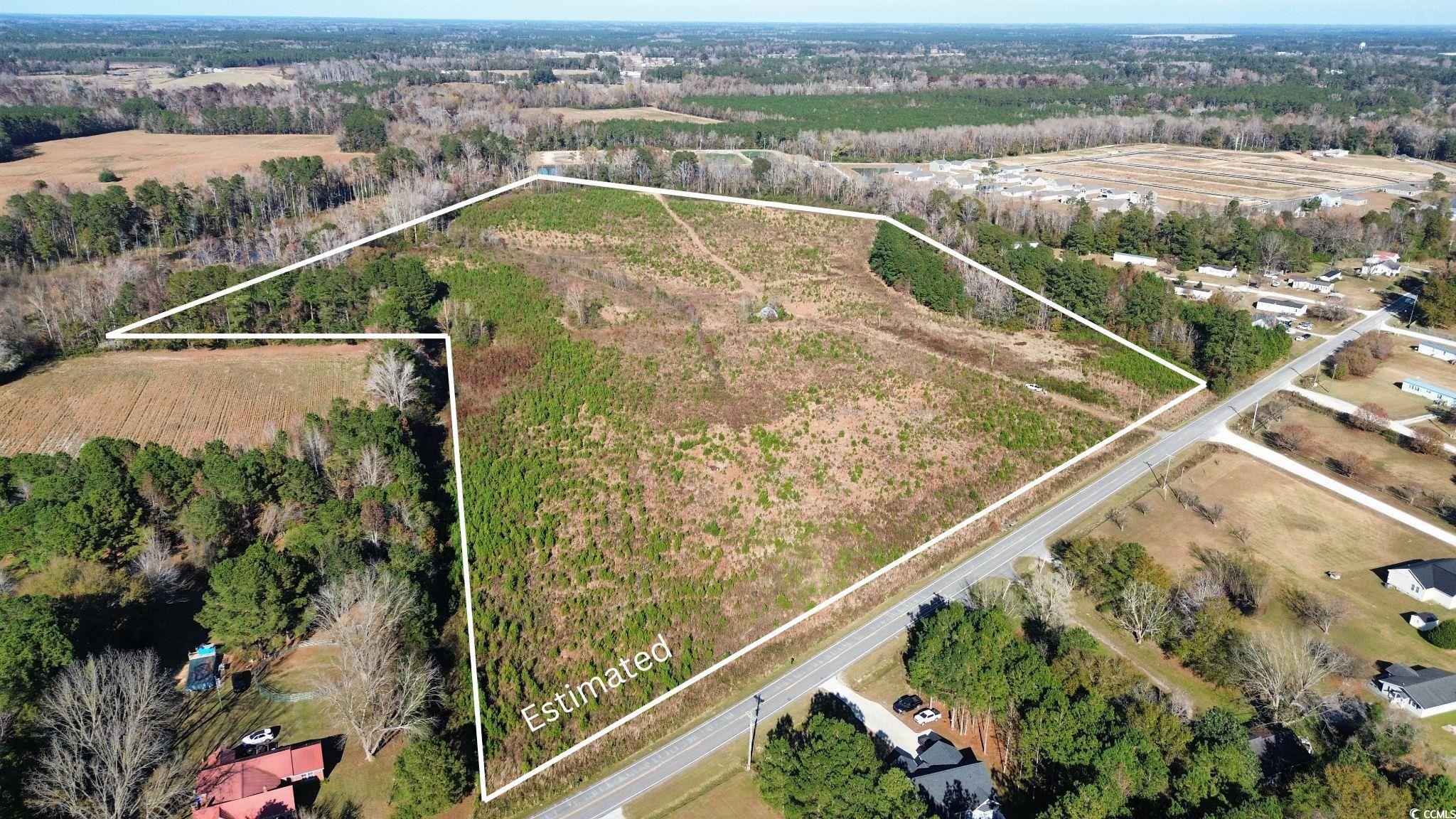 Aerial view of property's location featuring rural landscape and property parcel outlined