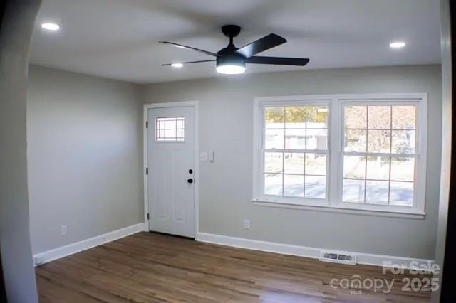 a view of an empty room with a window