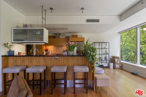 a room with furniture and a large window