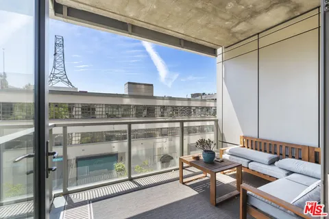 a view of balcony with furniture