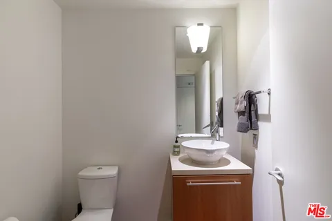 a picture of a wall with a white wall and a white refrigerator