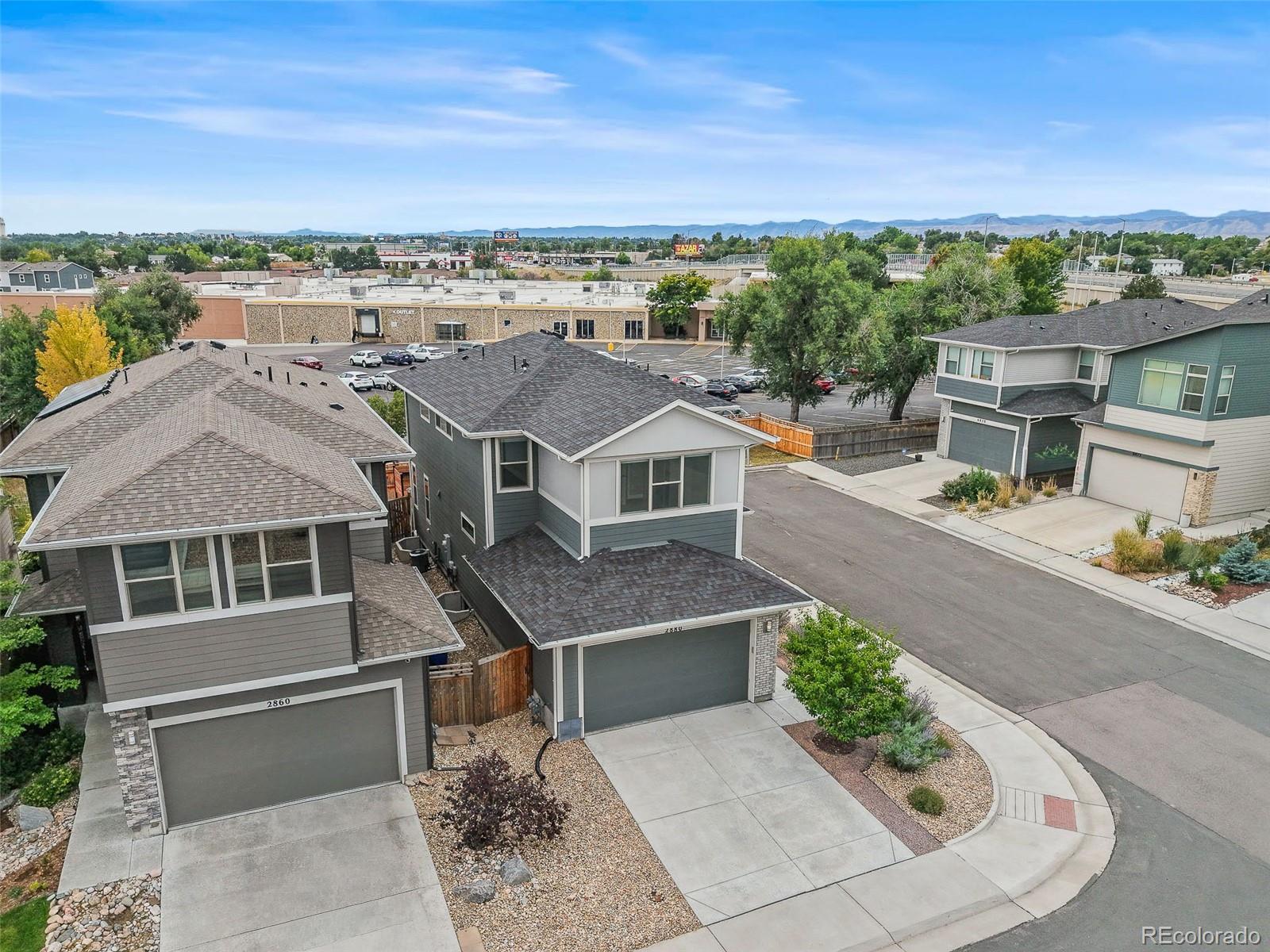 2880 West 69th Avenue Denver, CO 80221 - Photo 15 of 45 an aerial view of a house with a yard