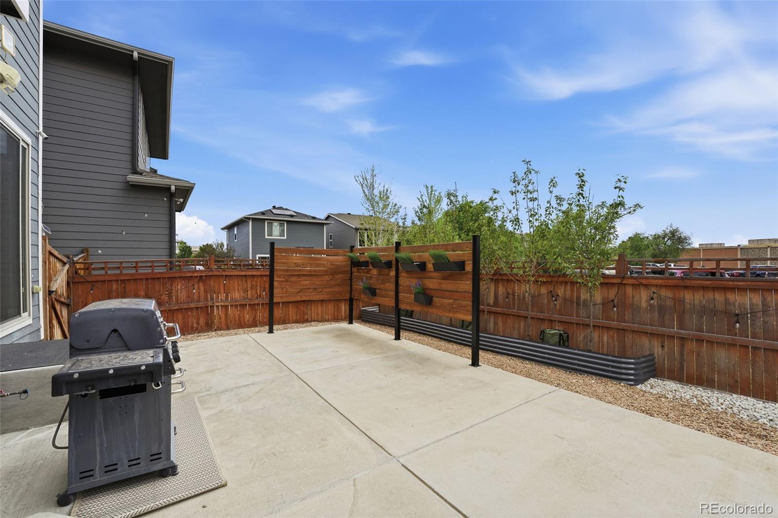 2880 West 69th Avenue Denver, CO 80221 - Photo 18 of 45 a view of a terrace with a bench