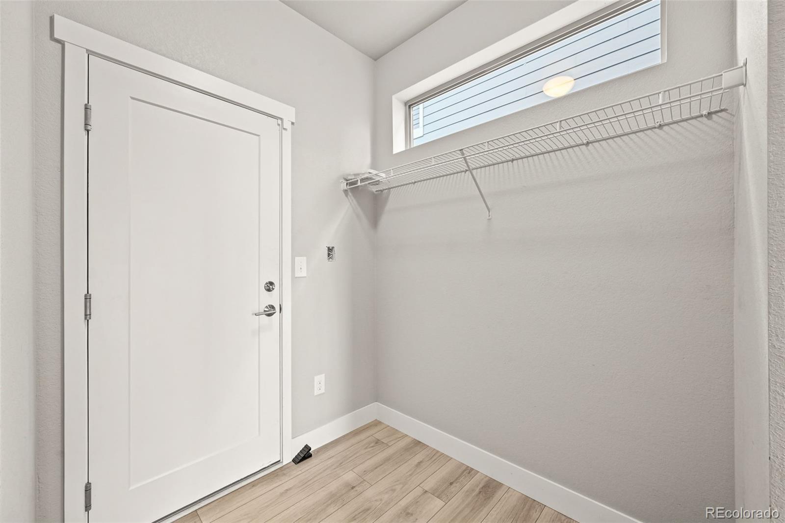 2880 West 69th Avenue Denver, CO 80221 - Photo 23 of 45 a view of a room with wooden floor