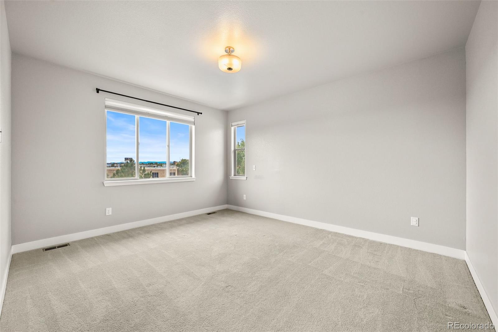 2880 West 69th Avenue Denver, CO 80221 - Photo 33 of 45 a view of an empty room with a window
