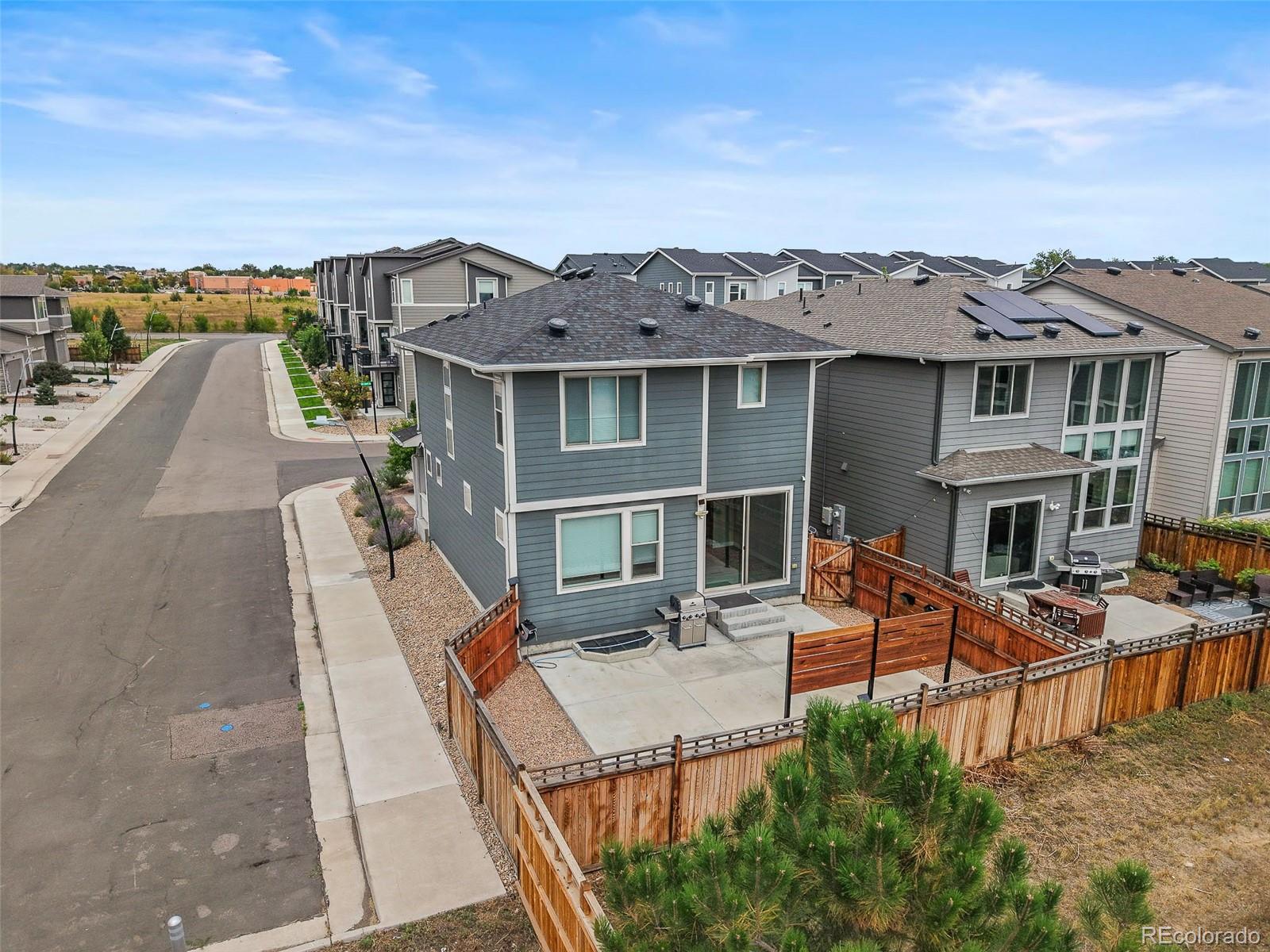 2880 West 69th Avenue Denver, CO 80221 - Photo 39 of 45 an aerial view of a house with a garden and barbeque oven