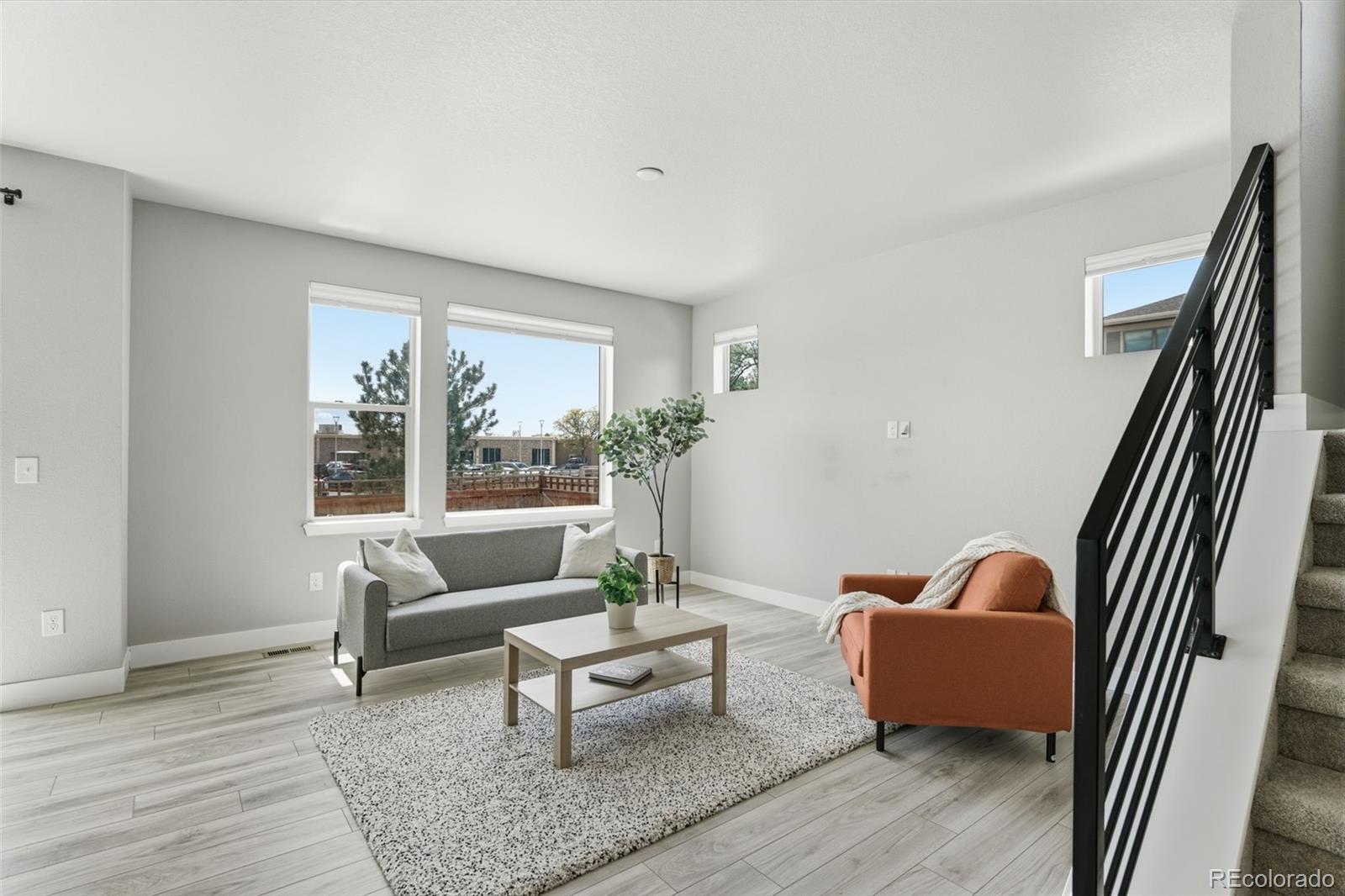2880 West 69th Avenue Denver, CO 80221 - Photo 7 of 45 a living room with furniture and a window