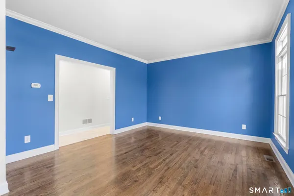a bathroom with a toilet a sink and a mirror