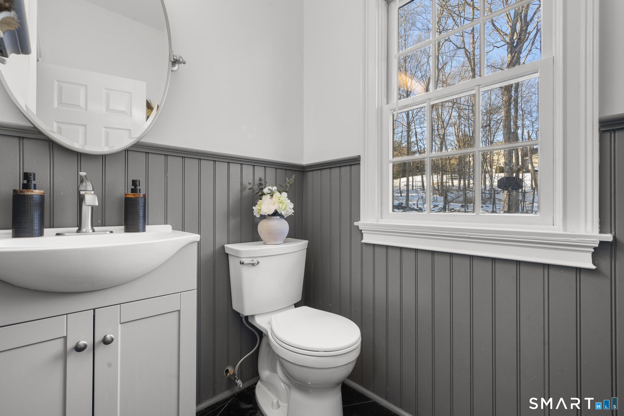 13 Surrey Lane Monroe, CT 06468 - Photo 15 of 40 a bathroom with a toilet a sink and a mirror
