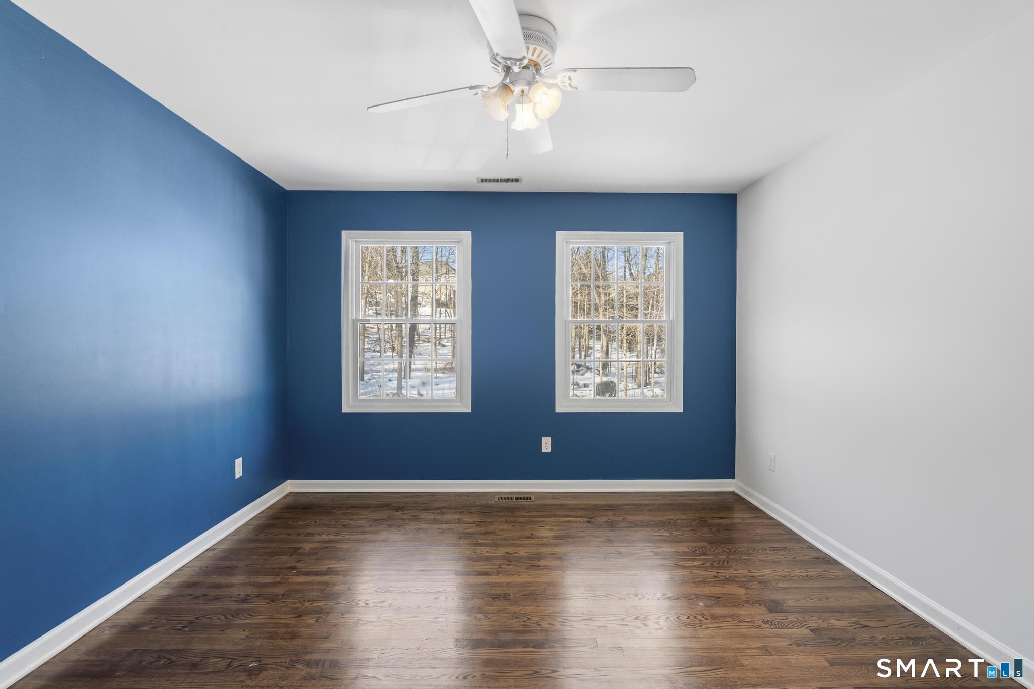 13 Surrey Lane Monroe, CT 06468 - Photo 17 of 40 a view of room with window ceiling fan and hardwood floor