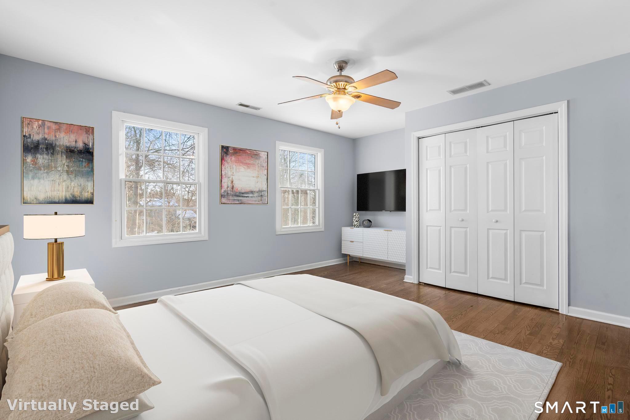 13 Surrey Lane Monroe, CT 06468 - Photo 19 of 40 a bedroom with a large bed and a flat tv screen on a dresser