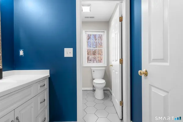 a spacious bathroom with a bathtub and shower