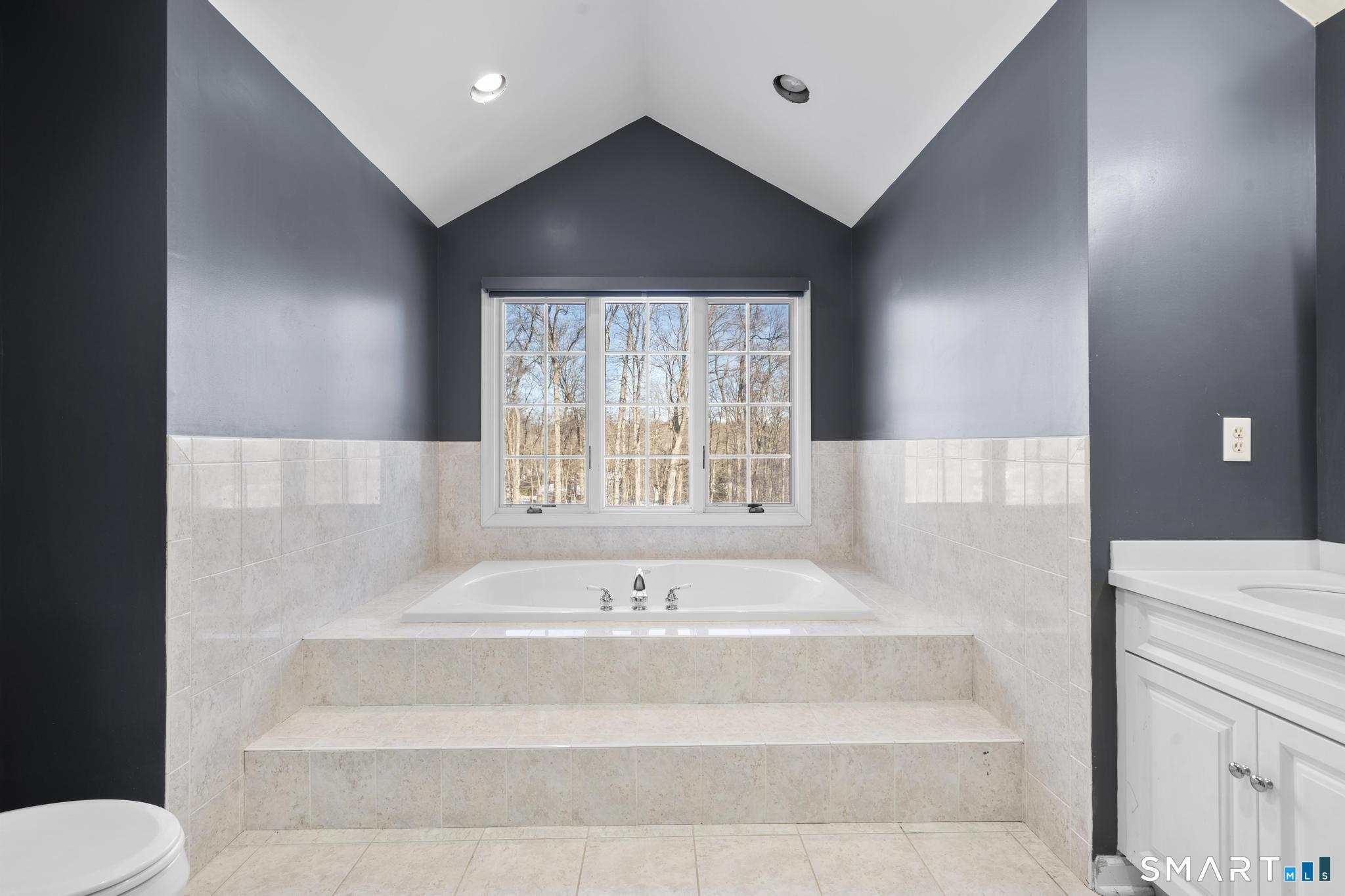 13 Surrey Lane Monroe, CT 06468 - Photo 26 of 40 a spacious bathroom with a bathtub and shower