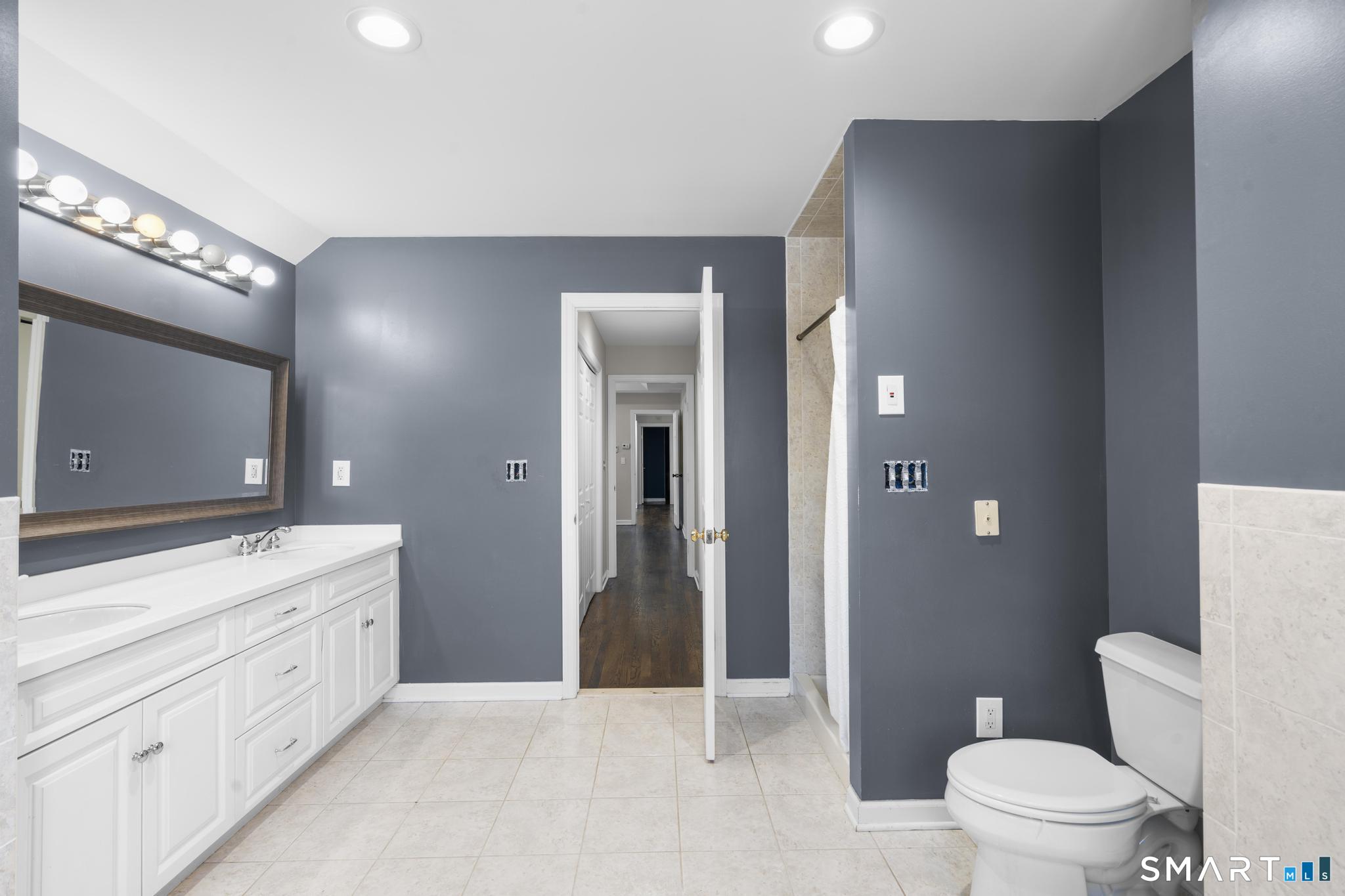 13 Surrey Lane Monroe, CT 06468 - Photo 27 of 40 a spacious bathroom with a double vanity sink toilet and shower