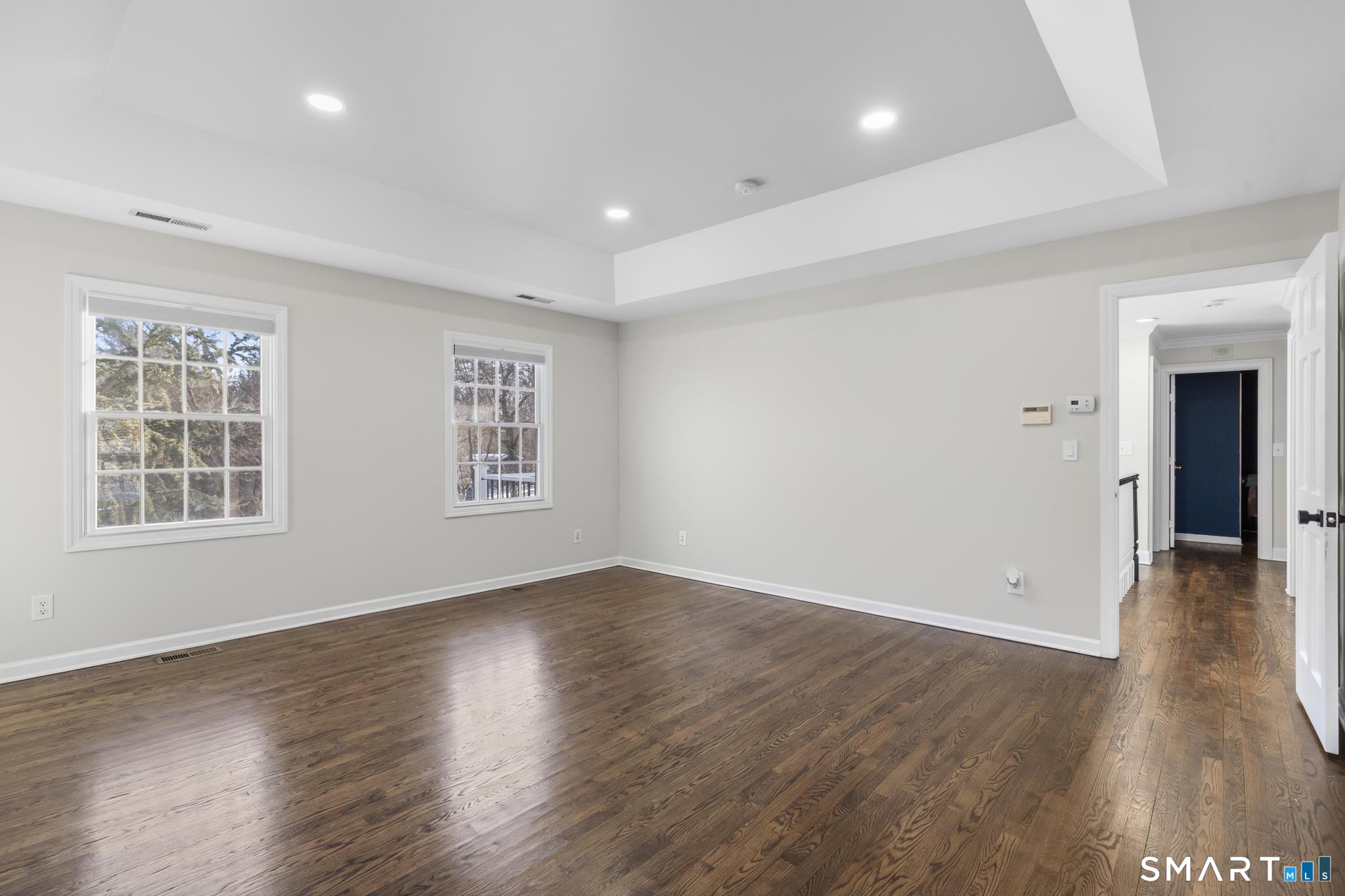 13 Surrey Lane Monroe, CT 06468 - Photo 28 of 40 a view of an empty room with wooden floor and a window