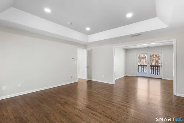 a view of walk in closet with clothes