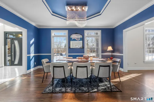a view of a dining room with furniture window and wooden floor