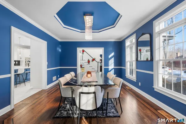 a view of a dining room with furniture window and wooden floor