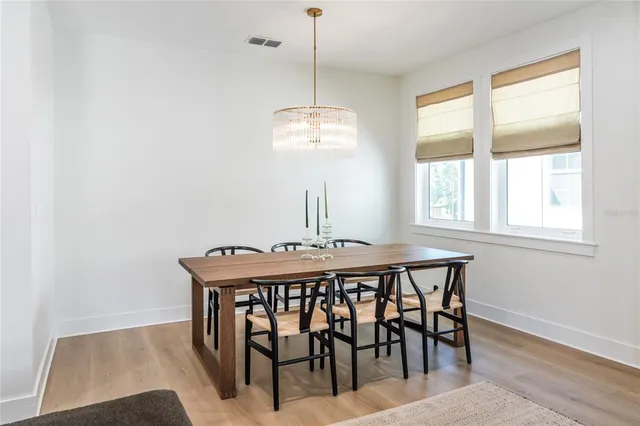 a dining room with furniture and window