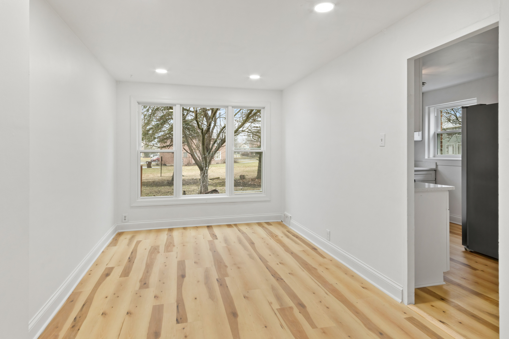 28 Dunlap Road Park Forest, IL 60466 - Photo 11 of 17 a view of empty room with wooden floor and fan