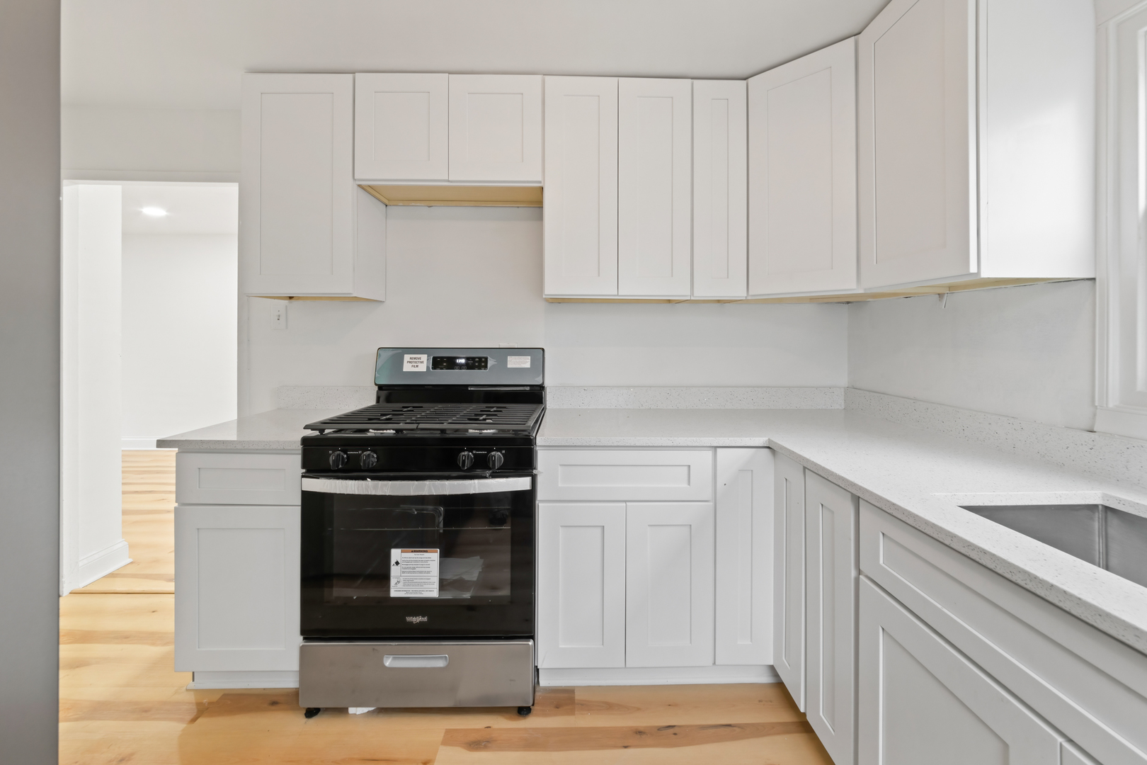28 Dunlap Road Park Forest, IL 60466 - Photo 12 of 17 a kitchen with white cabinets and appliances