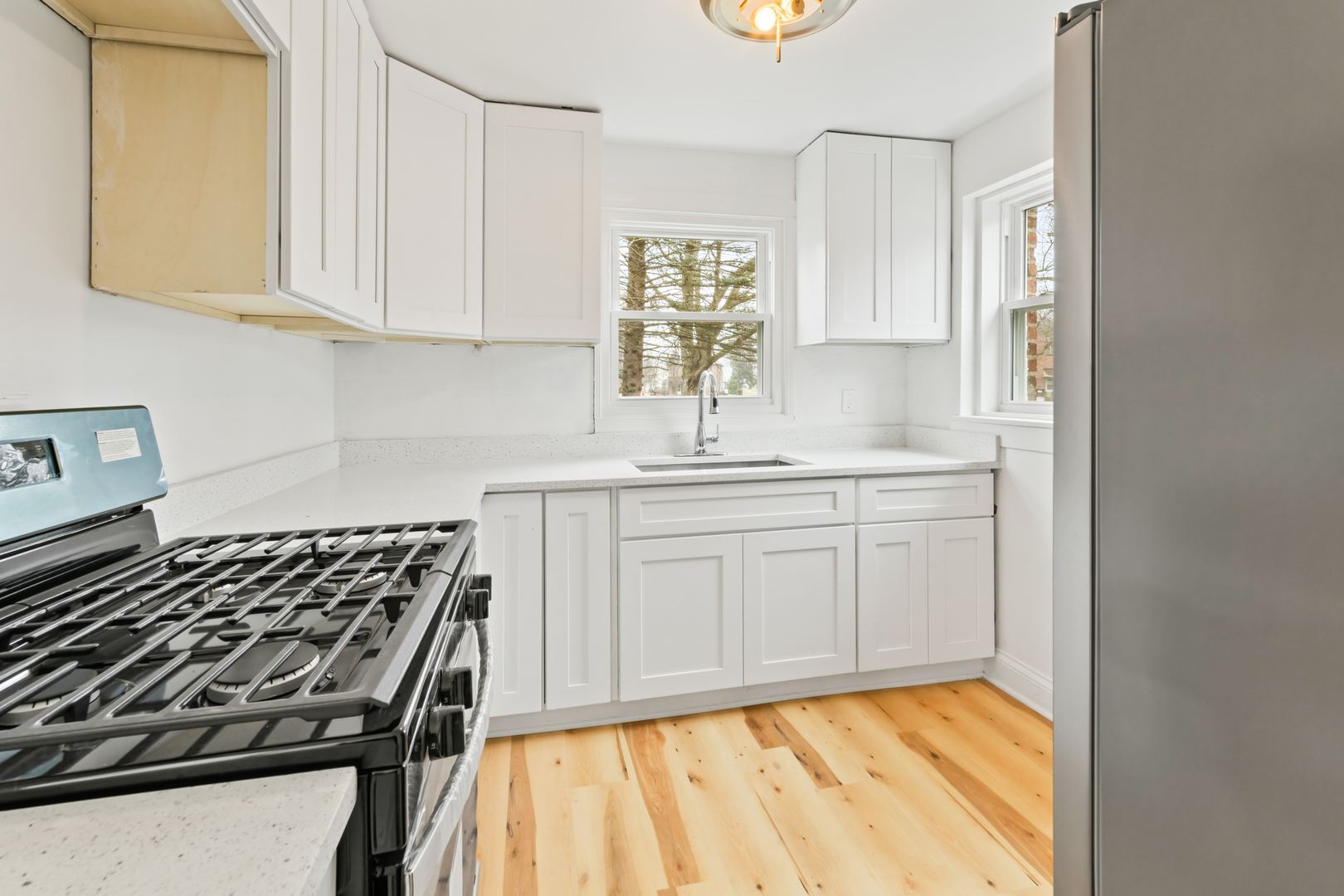 28 Dunlap Road Park Forest, IL 60466 - Photo 15 of 17 a kitchen with white cabinets stove and sink