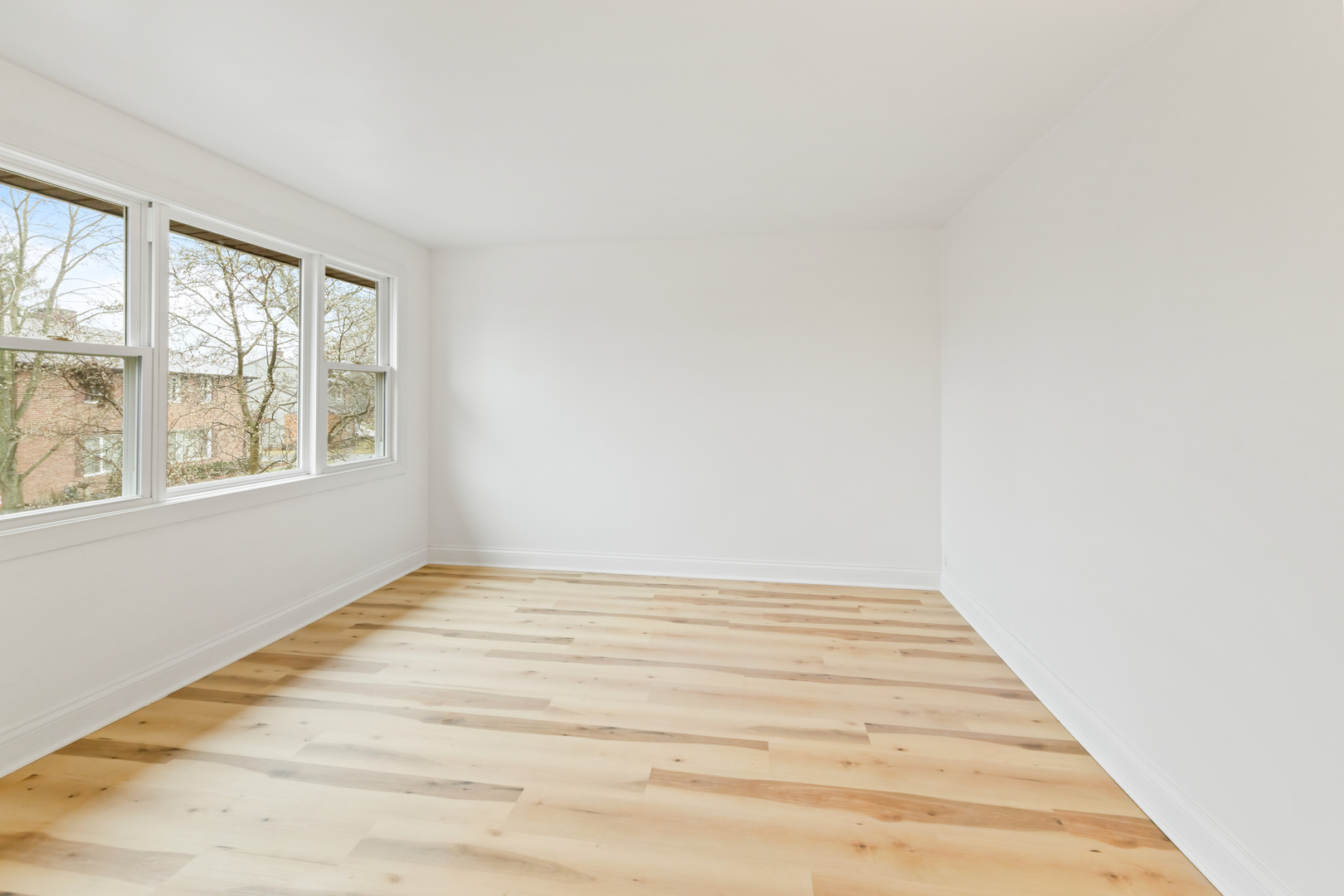 28 Dunlap Road Park Forest, IL 60466 - Photo 6 of 17 a view of an empty room with wooden floor and a window